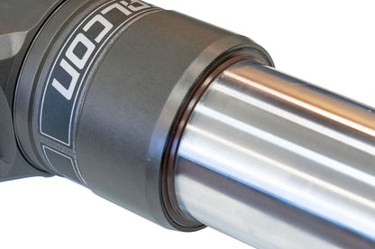Close-up of the FALCON 3.3 Fast Adjust Inverted Rally Strut for Sprinter 2WD, showcasing the metal cylinder and intricate engineering details.