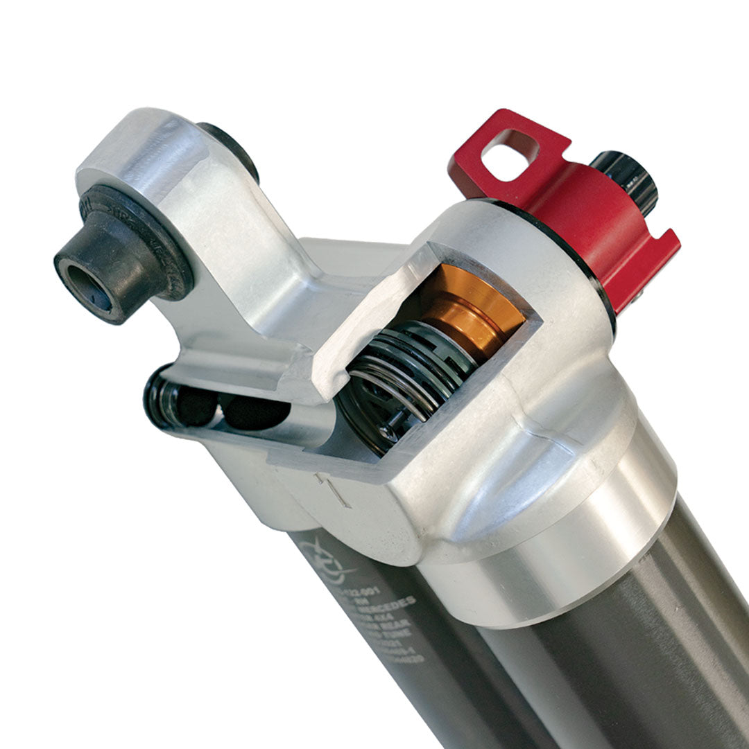 Close-up of the Falcon 3.3 adjustable rear shock from the Stage 2 System for Sprinter 2WD vans by Van Compass, showing its mechanical precision.