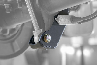 BAJA SUR Heavy Duty Rear Lower Shock Brackets for Sprinter 2500, showing close-up of laser-cut, reinforced metal brackets designed to protect and strengthen the van's shock mount.