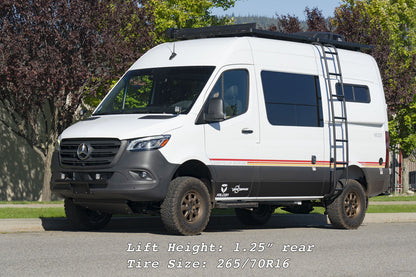 White van with a ladder on the roof, highlighting the STAGE 3 SYSTEM - SPRINTER AWD, 4X4 (2019-PRESENT 2500 ONLY) by VAN COMPASS, designed for improved handling and suspension.