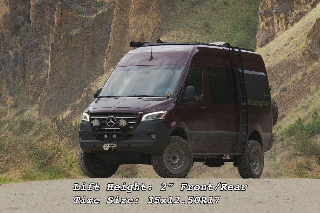 Van Compass Striker AWD 2 Lift Kit on a parked van, showcasing enhanced ground clearance and tire fitment for off-road capability.