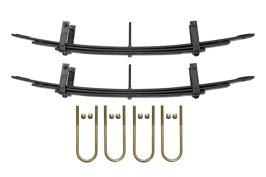 Rear Mini Spring Pack for Sprinter 4x4 (2015+ 2500) by VAN COMPASS, featuring a black curved metal structure with gold parts, enhancing ride quality and stability.