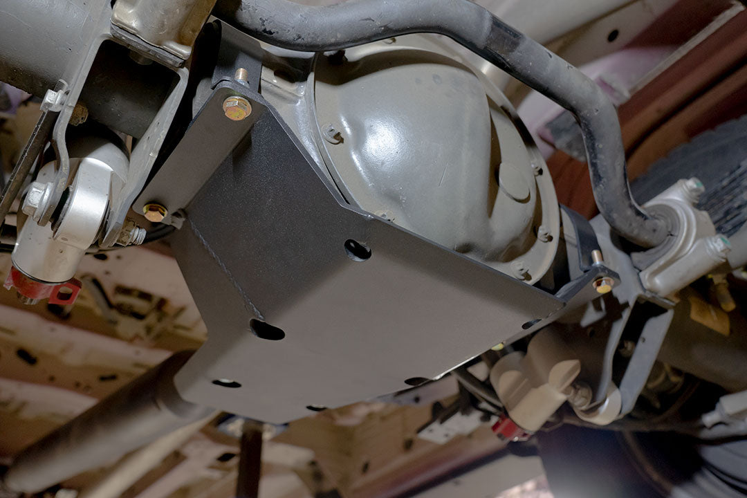 Differential Skid Plate for Sprinter (2015+ 3500) by Van Compass, showcasing close-up of the metal frame and protective plates, designed to safeguard the rear differential.