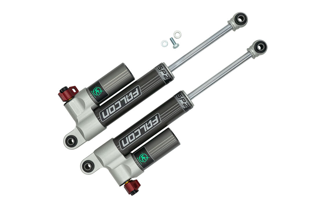 STAGE 4.3 DUALLY SYSTEM - SPRINTER AWD, 4X4 (2015-PRESENT 3500) by VAN COMPASS featuring black and red adjustable Falcon 3.3 shocks for improved handling and stability.
