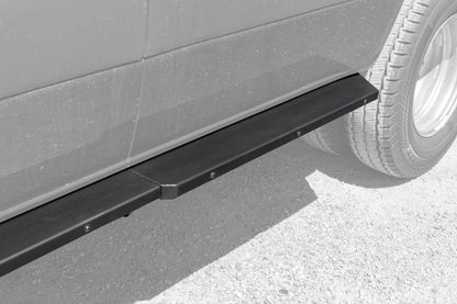 Rocker Guards - Sprinter 4x4 (2015-2022 170 Wheelbase Only) by Van Compass: Close-up of sturdy vehicle step and tire, showcasing robust steel construction for enhanced access and protection.