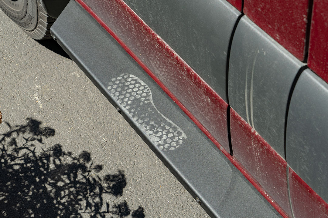 Rocker Guards - Sprinter 4x4 (2015-2022 170 Wheelbase Only) by Van Compass, showing a close-up of the robust step surface attached to a vehicle's chassis.
