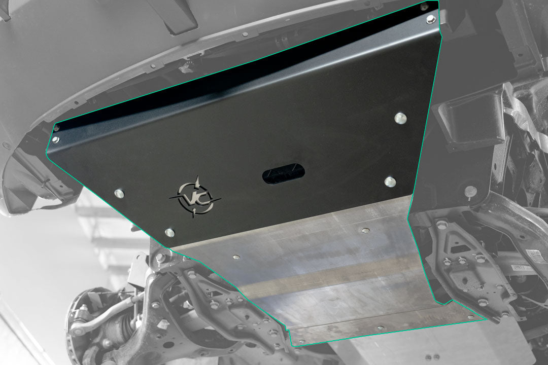Close-up of the Van Compass Engine Skid Plate for 2023+ Sprinter AWD, showcasing the metal plate's detailed design and logo for drivetrain protection.