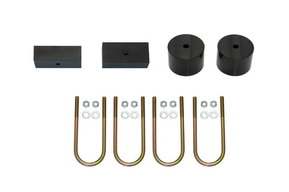 TERRAIN 2 REAR LIFT KIT - TRANSIT (2015+) by VAN COMPASS, featuring steel lift blocks, aluminum bump stop extensions, longer u-bolts, and all necessary hardware for installation.