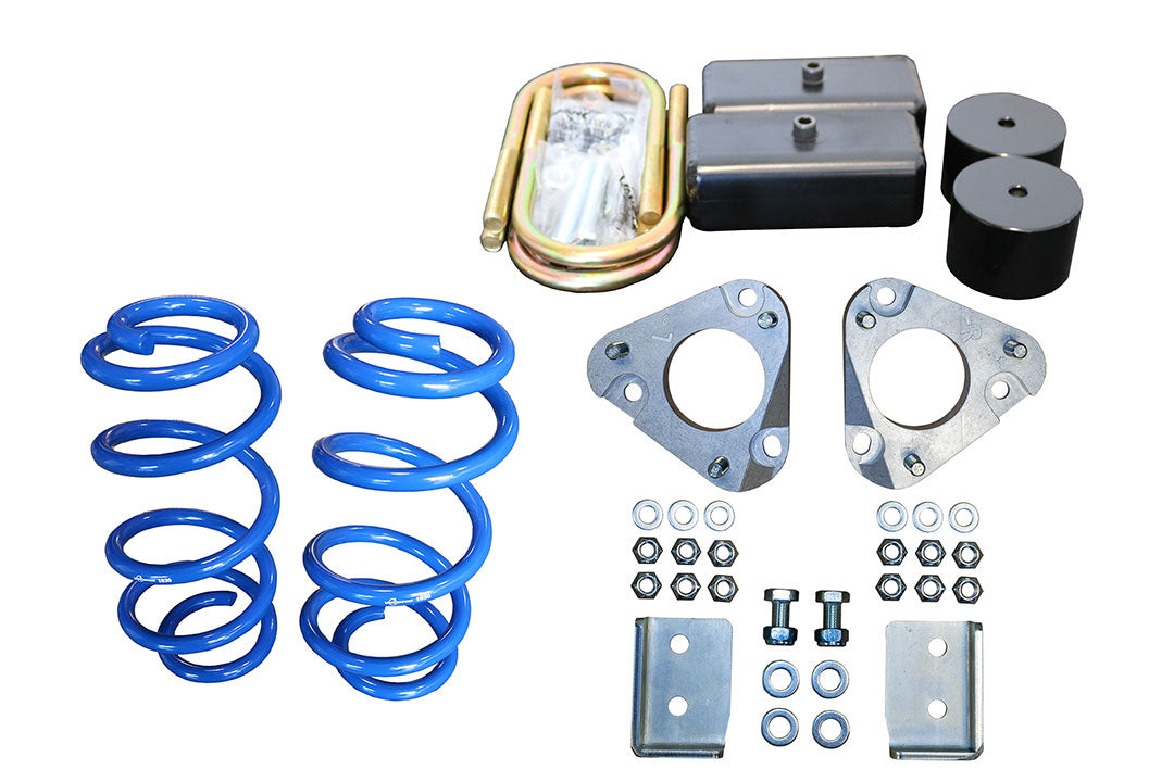 Stage 1 Topo 2.0 System parts, including blue coil springs and metal components, designed to improve the suspension of Ford Transit AWD vans.
