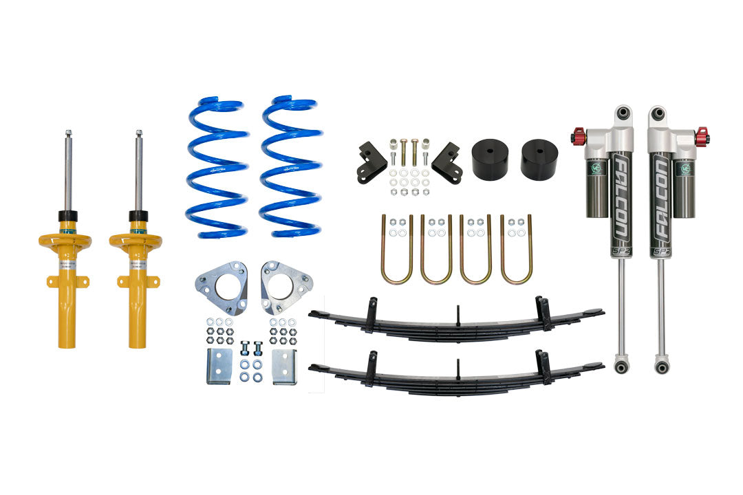 Close-up of the STAGE 4 TOPO 2.0 SYSTEM - TRANSIT RWD by VAN COMPASS, showcasing springs, shock absorbers, and metal parts designed for improved vehicle suspension and handling.