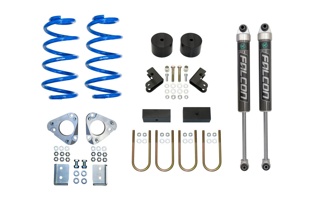 STAGE 1 TOPO 2.0 SYSTEM for Ford Transit AWD, featuring blue springs, black cylinders, metal bolts, and precision-engineered lift components by VAN COMPASS.