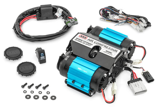 ARB Twin Air Compressor with wires and a round cap, featuring dual motors and sealed ball bearing motors for reliable, high-volume air supply.