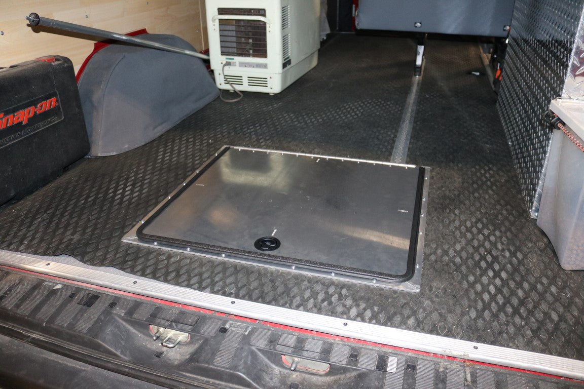 Van Compass Rear Storage Trunk for Sprinter (2007+), a metal box designed to utilize space under the vehicle, enhancing storage with a 300lb cargo rating.