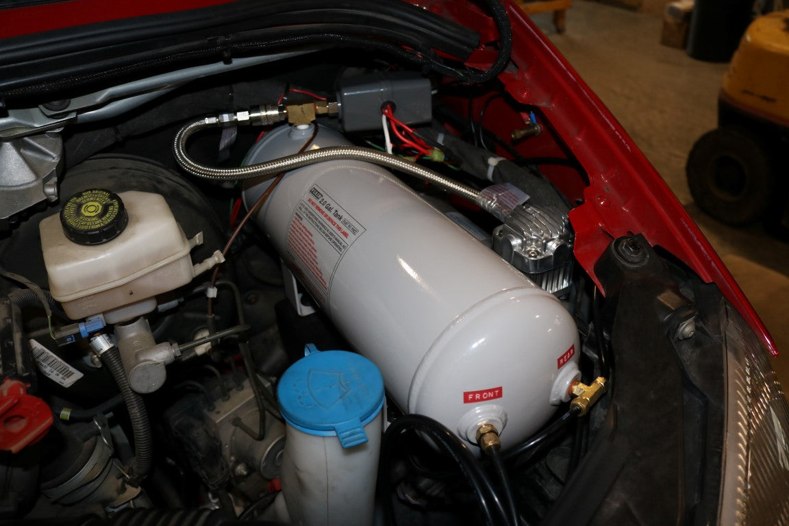 AIR SYSTEM MOUNT - SPRINTER (2007-2018) by VAN COMPASS, featuring a white cylinder with black wires and a blue lid, designed for Viar 2.0 Gallon air tank installation.