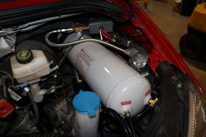 AIR SYSTEM MOUNT - SPRINTER (2007-2018) by VAN COMPASS, featuring a white cylinder with black wires and a blue lid, designed for Viar 2.0 Gallon air tank installation.