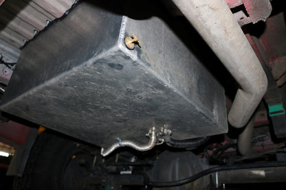 Rear Storage Trunk - Sprinter (2007+) by Van Compass, a sturdy metal box with a screw and hose, designed for added storage beneath the vehicle.