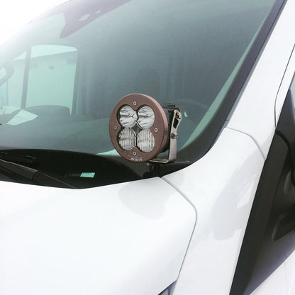 Hoodline Light Pod Mount - Transit (2013+) by Van Compass, shown installed on a truck's windshield with a close-up of mounting hardware for LED pod lights.