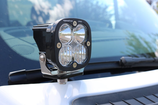 Close-up of the HOODLINE LIGHT POD MOUNT for Sprinter vans (2019+) by VAN COMPASS, showing the bolt-on mounts designed for easy installation on factory hood hinge studs.