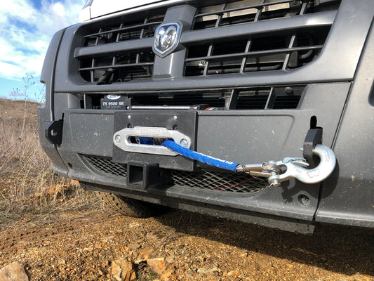 HIDDEN WINCH MOUNT - 2013-2022 RAM PROMASTER by VAN COMPASS: Close-up of a truck‚Äôs front winch mount system with visible tow hook and shackle anchor points.