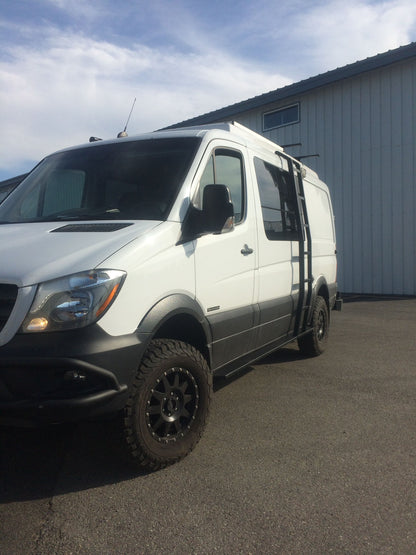 Side Ladder - Sprinter (2007-Current, Low Roof Only) by Van Compass attached to a parked white van, enabling easy roof access without drilling.