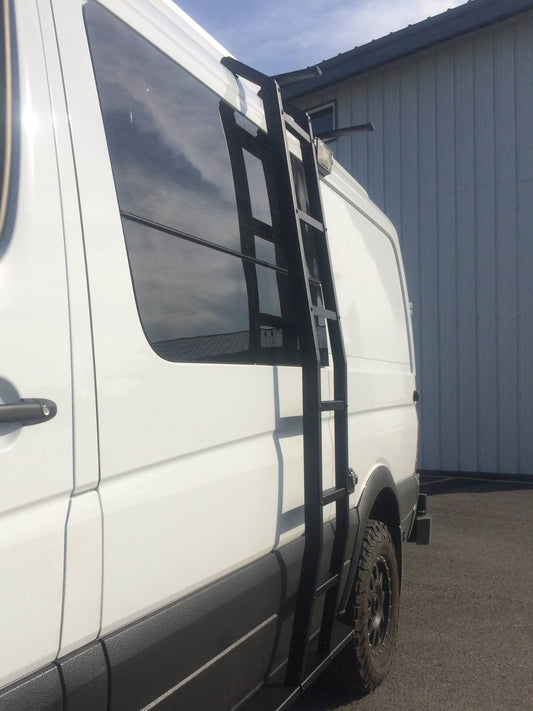 Side ladder mounted on a white van, designed for Sprinter models (2007-current, low roof only) by Van Compass. The ladder attaches without drilling.